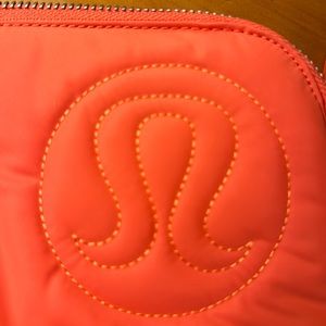 Tangerine LuLulemon clutch with wallet section and removable key tag New